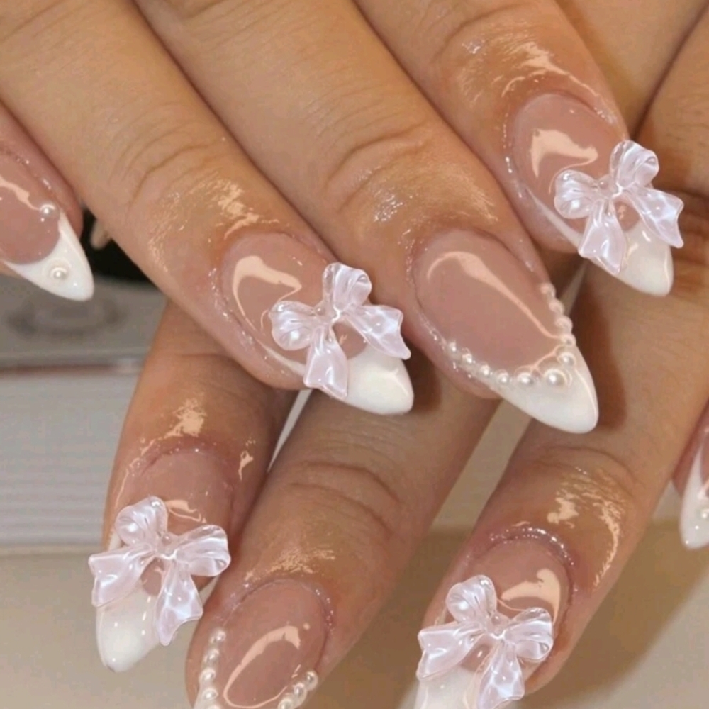 Elegant White Nail Art with Bow Accents